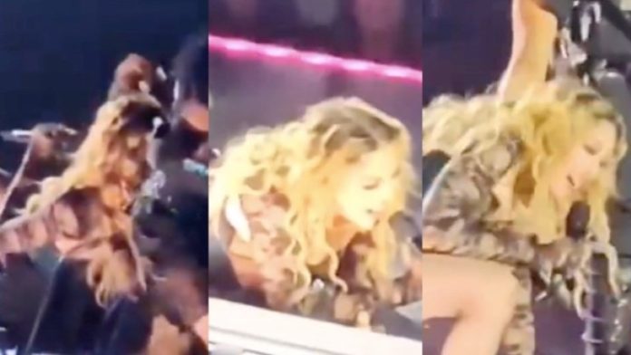 Madonna é derrubada por dançarino em show e dá risada da situação. Veja o vídeo!