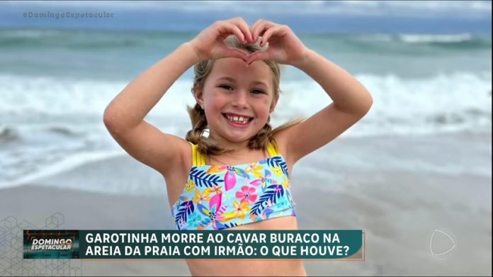 Menina de 7 anos morre soterrada enquanto brincava de cavar buraco na areia da praia - RecordTV